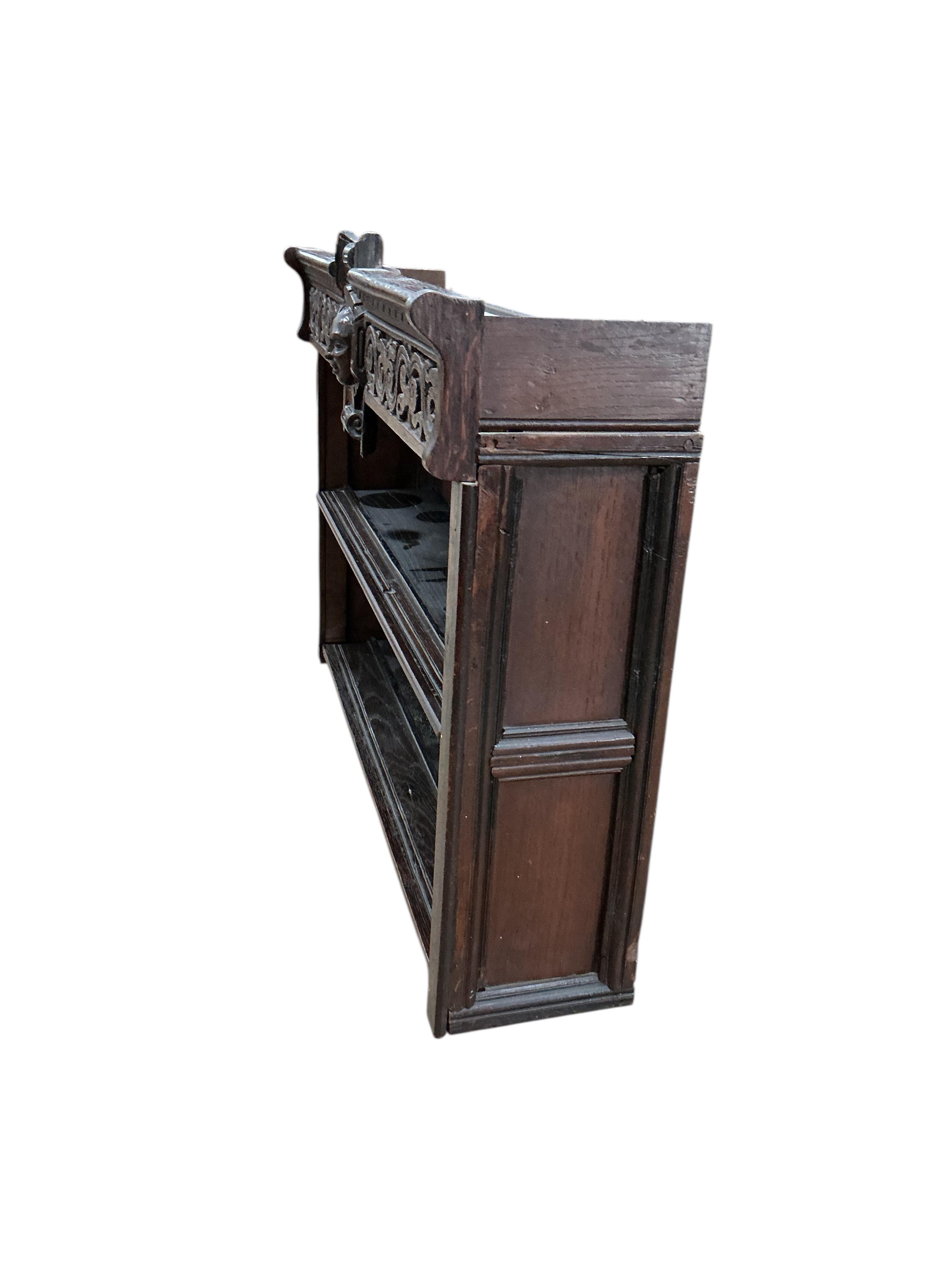An 18th century style carved oak wall bracket, width 88cm, depth 22cm, height 66cm